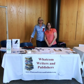 Kiffer Brown of Chanticleer Reviews and Amanda June Hagarty staff the Whatcom Writers and Publishers table